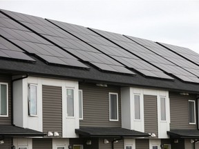 Solar panels on a row of townhouses.