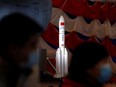 A model of the Long March-5 Y5 rocket from China's lunar exploration program Chang'e-5 Mission is displayed at an exhibition inside the National Museum in Beijing, March 3, 2021.