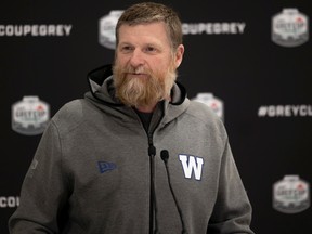 Winnipeg Blue Bombers head coach Mike O'Shea speaks with the after the team's arrival in Regina on Tuesday.