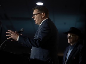 Saskatchewan Premier Scott Moe addresses a crowd during the Grain Expo Conference at Canadian Western Agribition on Nov. 29, 2022 in Regina.