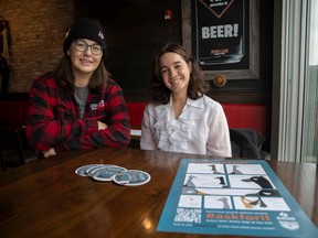 Brewer Vanessa Owen, left, and Ashley Kilback, Communications Specialist with the Sexual Assault Services of Saskatchewan, sit with with some of the campaign materials (coasters, posters) for the new #ASKFORIT campaign, which seeks to raise awareness around and educate people on sexual consent at Rebellion Brewing on Tuesday, November 1, 2022 in Regina. These materials are being distributed to locations serving Rebellion beer so they can be placed in areas where alcohol will be consumed.