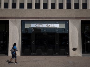 A person walks into Regina's city hall.