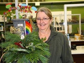 Sarah McKen holds her Pride planter at the GreenAcres Greenhouse in Watrous, Sask. on December 14, 2022. (Julia Peterson/Saskatoon StarPhoenix)