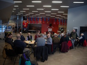 Retired RCMP members, shown Thursday at the RCMP Heritage Centre, are part of a coffee group that is donating roughly $1,500 to the Leader-Post Christmas Cheer Fund.