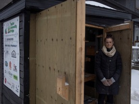 Josée O'Blenis, one of five volunteers that help run the community fridge at 3037 Dewdney Ave., stands at the fridge on Nov. 28, 2022 She is one of five volunteers that help run that community fridge.