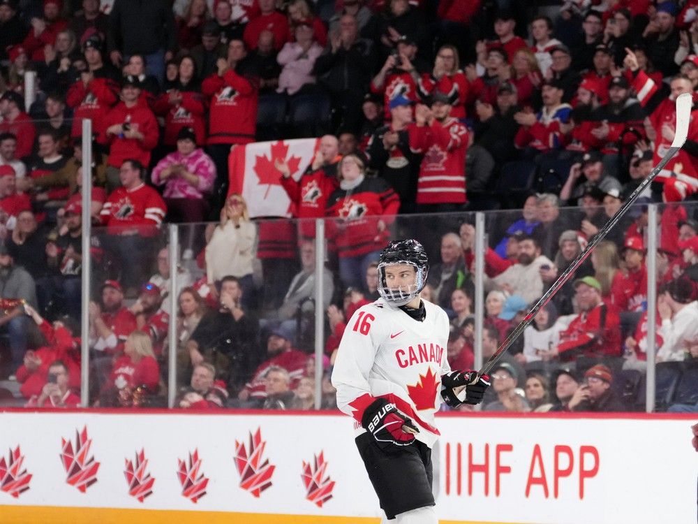 Hats are thrown from the crowd as Canada's Connor Bedard