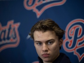 Connor Bedard, shown speaking with the media at the Brandt Centre on Wednesday, reiterated his desire to complete his WHL career with the Regina Pats.