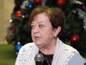 Donna Harpauer, minister of finance, speaks in the rotunda of the Legislative Building on Monday.