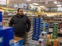 Jesse Dubois, an SLGA customer service representative in Fort Qu'Appelle, stands inside the store on Dec. 16, 2022.