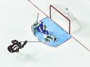 The Regina Pats' Connor Bedard, shown scoring against Slovakian netminder Adam Gajan in a quarter-final on Monday, is now Canada's all-time leading goal-scorer at the world junior hockey championship.