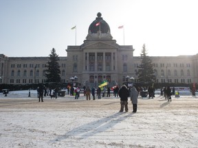 People are seen at a rally at the Saskatchewan Legislative Building in Regina, Saskatchewan on Jan. 30, 2021.