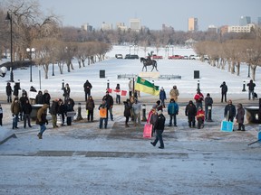 People are seen at a rally at the Saskatchewan Legislative Building in Regina, Saskatchewan on Jan. 30, 2021. Four people are now on trial for violating public health orders as a result of their participation in the rally. BRANDON HARDER/ Regina Leader-Post