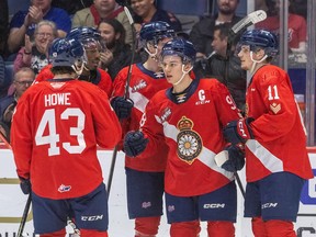 Regina Pats captain Connor Bedard celebrates with teammates at the Brandt Centre on Friday night, where he had three goals and two assists in a 7-4 victory over the Saskatoon Blades.