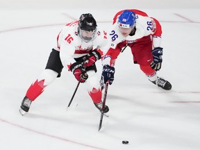 Canada's Connor Bedard, left, and Czechia's Martin Rysavy are shown during Thursday's world junior hockey championship gold-medal game in Halifax.