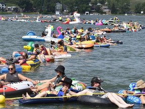 More than 400 people dug out their inner tubes and linked hands at Lac Pelletier, Sask. to break the Guinness World Record for longest line of water inflatibles on July 30, 2022. (photo supplied / Lac Pelletier Regional Park)
