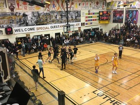The Saskatoon Holy Cross Crusaders celebrate after defeating the LeBoldus Golden Suns to win the senior boys title at the 2020 Luther Invitational Tournament. The photo is taken from Rob Vanstone's vantage point in the press box.