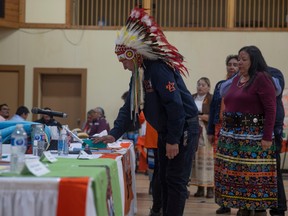 Star Blanket Cree Nation Chief Michael Starr touches a box with the found remains of a child as Star Blanket Cree Nation Leadership announces its initial finding at the Qu'Appelle Indian Residential School Site at Wa-Pii Moostoosis Whitecalf Gym on Thursday, Jan. 12, 2023 in Lebret.