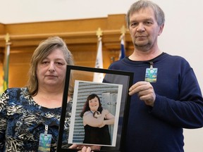 Barbara Stuckey, left, and her husband Barry hold a photo of their daughter Jessica at the Legislative Building on Tuesday, January 17, 2023 in Regina. TROY FLEECE / Regina Leader-Post
