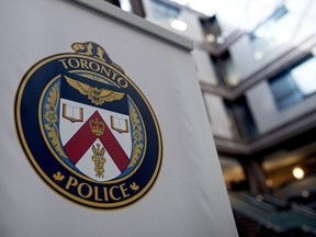 A Toronto Police Services logo is shown at headquarters, in Toronto, on Friday, August 9, 2019. Toronto police say they have not confirmed whether a group of teen girls who allegedly assaulted several people at public transit stations are the same ones that allegedly stabbed a homeless man on the same night.