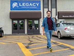 Former student Nick Hutchinson walks away from Legacy Christian Academy while posing for a photograph in Saskatoon, Sask. on Thursday, August 11, 2022. During his time at the school, he alleges church and school officials physically assaulted him and psychologically manipulated him and his family.