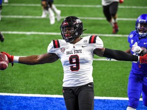 Christian Albright of the Ball State Cardinals celebrates a fumble-return touchdown  against the Buffalo Bulls on Dec. 18, 2020 at Ford Field in Detroit.