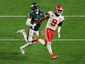 James Bradberry, left, of the Philadelphia Eagles is called for holding against JuJu Smith-Schuster of the Kansas City Chiefs late in the fourth quarter of Sunday's Super Bowl in Glendale, Ariz.