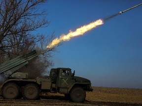 Ukrainian servicemen fire a BM-21 Grad multiple launch rocket system towards Russian troops, amid Russia's attack on Ukraine, in Donetsk region, Ukraine February 11, 2023. REUTERS/Yevhenii Zavhorodnii