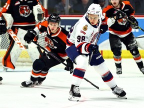 Connor Bedard (98) of the Regina Pats keeps his eye on the puck during Wednesday's 6-3 win over the visiting Medicine Hat Tigers. Keith Hershmiller Photography.