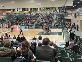 The University of Regina Cougars celebrate a 56-53 victory over the University of Calgary Dinos in Canada West women's basketball on Saturday at the Centre for Kinesiology, Health and Sport.