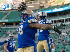 Offensive lineman Eric Lofton, 58, celebrates a Winnipeg Blue Bombers touchdown during a May 31 pre-season game against the Saskatchewan Roughriders at Mosaic Stadium on May 31. The Roughriders announced the signing of Lofton on Friday.