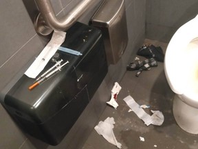 This submitted photo shows syringes and a sterile water bottle sitting on a toilet paper dispenser in a bathroom stall. The photo, said to have been taken recently at a Regina McDonalds location, depicts what Phionna Cleland says is an ongoing problem at the restaurant. (Submitted to the Leader-Post by Phionna Cleland)