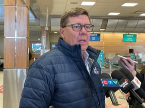 Saskatchewan Premier Scott Moe speaks with media during an appearance at Regina International Airport on Feb. 5, 2023.