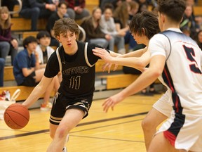 Dylan Mohrbutter, left, is shown playing for the Luther Lions senior boys basketball team on Saturday at the 69th Luther Invitational Tournament.