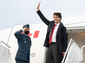 Prime Minister Justin Trudeau boards his plane in Ottawa as he leaves on a 10-day international trip on Tuesday, June 21, 2022.