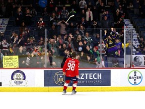 Connor Bedard tosses his stick into the crowd at the Brandt Centre following a recent game. Bedard has a long-standing superstition that nobody can touch his stick before a contest. Keith Hershmiller Photography.