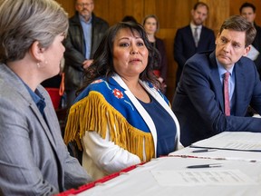 Blueberry Nation Chief Judy Desjarlais, centre, and B.C. Premier David Eby as the province and Blueberry River First Nations reach historic agreement in January.