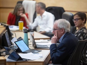 Councillor Bob Hawkins of Ward 2 sits during a city council meeting at Henry Baker Hall at City Hall on Thursday, March 23, 2023 in Regina.
