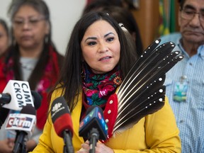 Official Opposition Critic for First Nation and Metis Relations Betty Nippi-Albright stands in front of Indigenous leaders from across the province at the Legislative Building on Jan. 23, 2023.