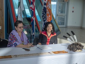 REGINA, SASK : March 24, 2023--  Jennifer Dockstader, Executive Director, Fort Erie Native Friendship Centre signs an agreement with Dr. Jacqueline Ottmann, President, First Nations University of Canada during an event to sign a partnership agreement between the Ontario-based Fort Erie Native Friendship Centre (FENFC), First Nations University of Canada (FNUniv), and University of Regina (U of R) to offer the Mohawk Language Certificate Program on Friday, March 24, 2023 in Regina. KAYLE NEIS / Regina Leader-Post