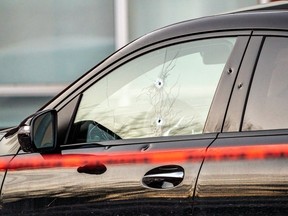 Bullet holes can be seen in the driver's side window and door of a Mercedes GLE 53 in Laval on Wednesday, March 15, 2023, after an apparent assassination attempt on Leonardo Rizzuto.