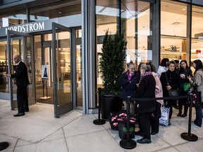More than 960 employees cheer as costumers enter the store during Nordstrom's Grand Opening at Pacific Centre in Vancouver, B.C., Friday September 18, 2015, Nordstrom officially opens its doors to its third Canadian store and first international flagship store at Pacific Centre. Photo by Carmine Marinelli.