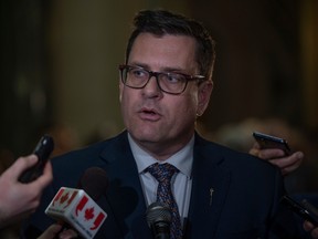 Minister of Health Paul Merriman speaks to the media at the rotunda during the presentation of the 2023-2024 provincial budget at the Saskatchewan Legislature on Wednesday, March 22, 2023 in Regina.