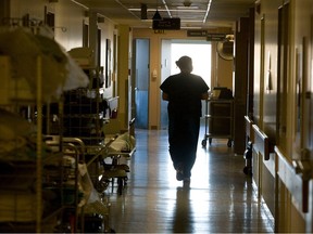 A nurse walks through the halls at St. Paul's Hospital on Wednesday, January 11, 2012 in Saskatoon, Sask.