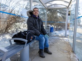 Dylan Morin at a transit stop outside the Riddell Centre at the University of Regina on Tuesday, March 28, 2023.