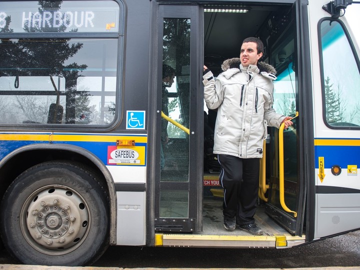  Dylan Morin is shown riding a Regina city transit bus.