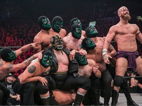 Evil Uno (Nicolas Dansereau, front, centre) and Stu Grayson (Marc Dionne, right) are key members of The Dark Order in All Elite Wrestling, which hit the ground running in 2019 and has made a huge impact since. Credit: ALL ELITE WRESTLING
