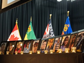 Photos of the victims from the James Smith Cree Nation stabbing rampage are on display with candles on stage where RCMP will be outlining what happened during the tragedy in Melfort, SK. Photo taken in Saskatoon, Sask. on Thursday, April 27, 2023.