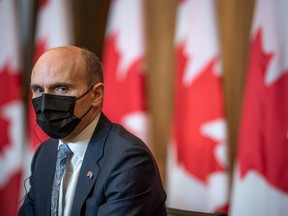 Health Minister Jean-Yves Duclos looks on during a press conference in Ottawa on Friday, Nov. 25, 2022. A parliamentary health committee is weighing the need for new legislation that would force the Pubic Health Agency of Canada to table its plans to prevent and prepare for future pandemics in the House of Commons.
