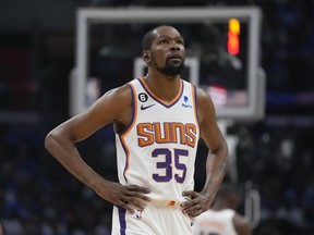Phoenix Suns forward Kevin Durant walks on the court during the first half of of Game 3 of a first-round NBA basketball playoff series against the Los Angeles Clippers in Los Angeles, Thursday, April 20, 2023.