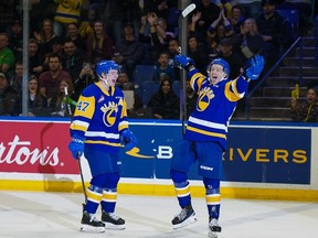 Egior Sidorov (right) and Charlie Wright celebrate a goal for the Saskatoon Blades against the Regina Pats in WHL Eastern Conference playoff action on Good Friday at SaskTel Cwntre.